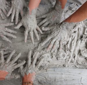 hands stuck in mud