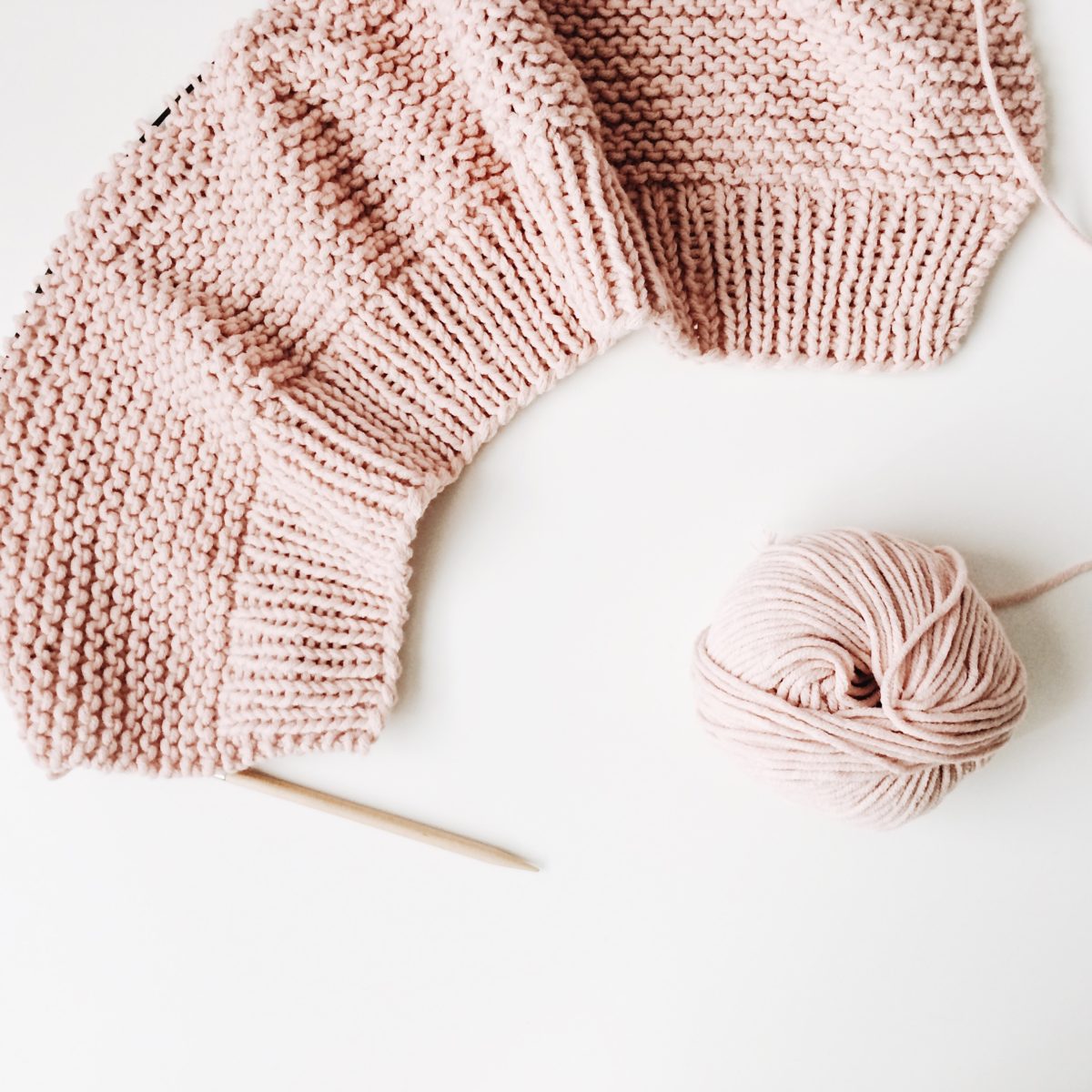 pink yarn and knitting needles