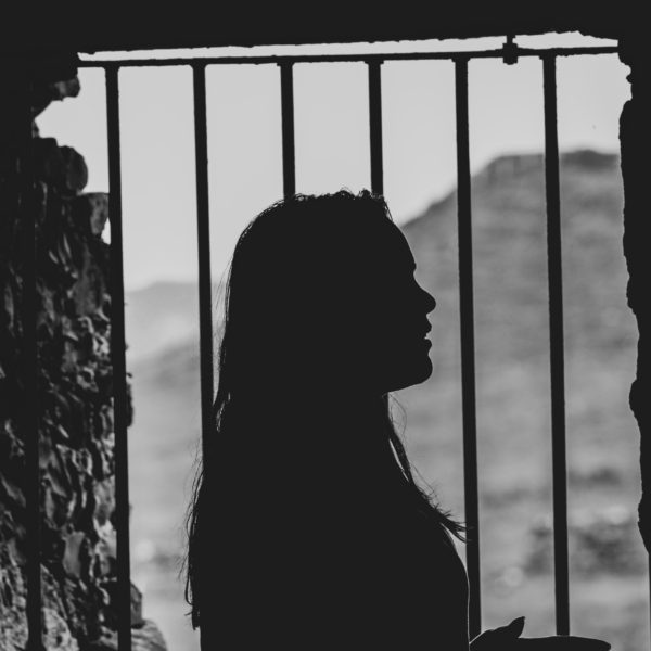 girl and window with bars